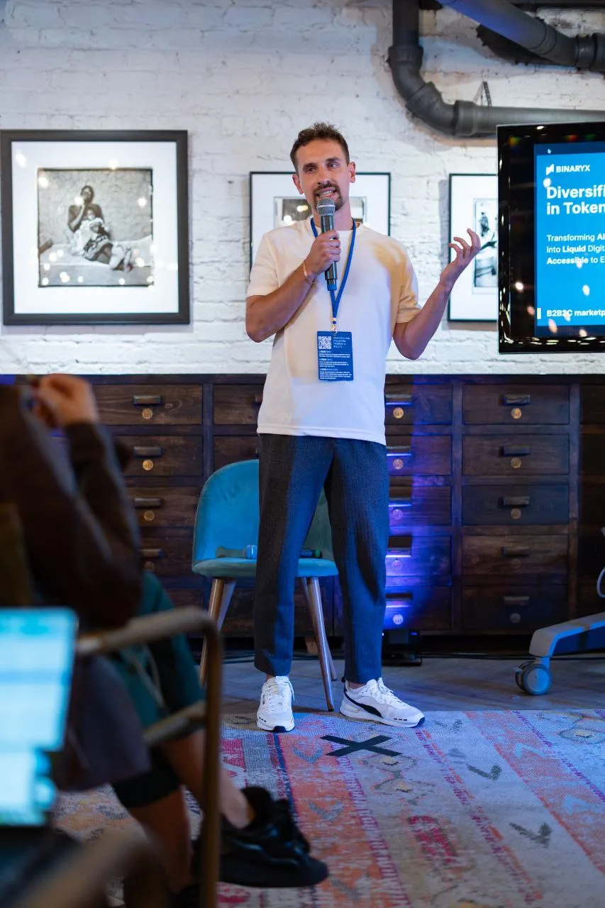 Binaryx team member presenting the company's any-asset, diversification vision at a pitch event