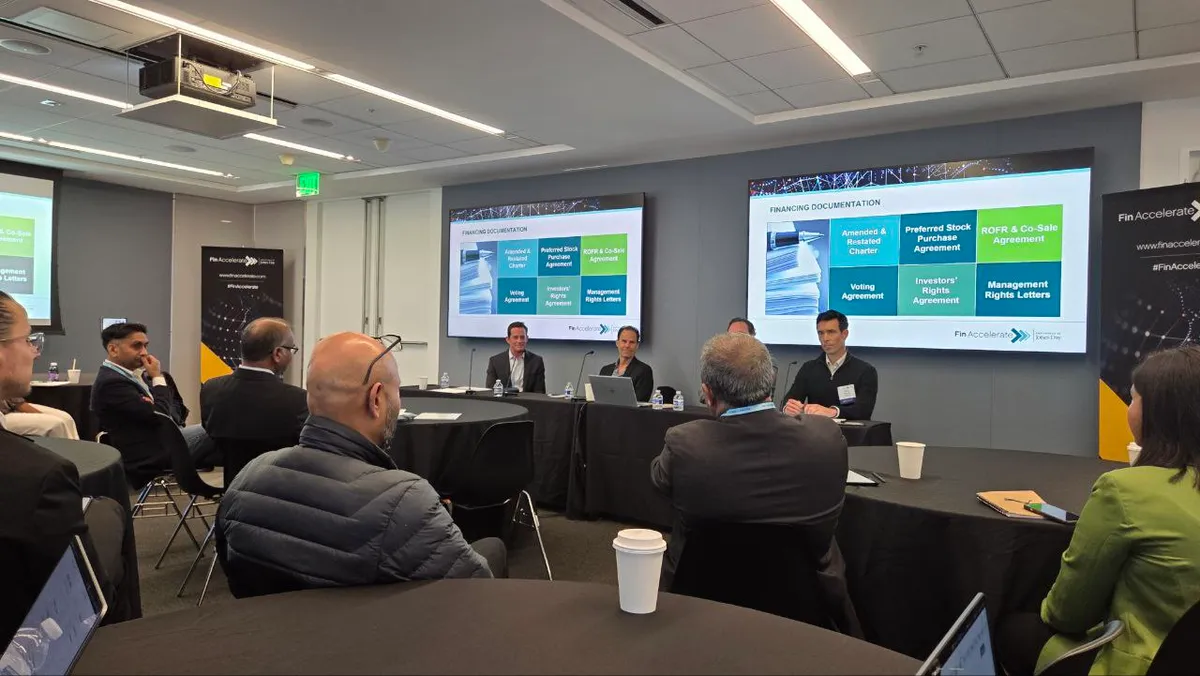 Fin Accelerate working session on financing documentation with panelists in front of slides on stock purchase and investor rights agreements
